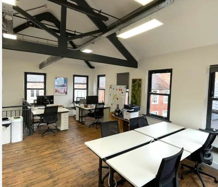 Works Social coworking space — 16 Commerce Square, Lace Market, Nottingham — exposed Victorian roof beams and original hardwood floors